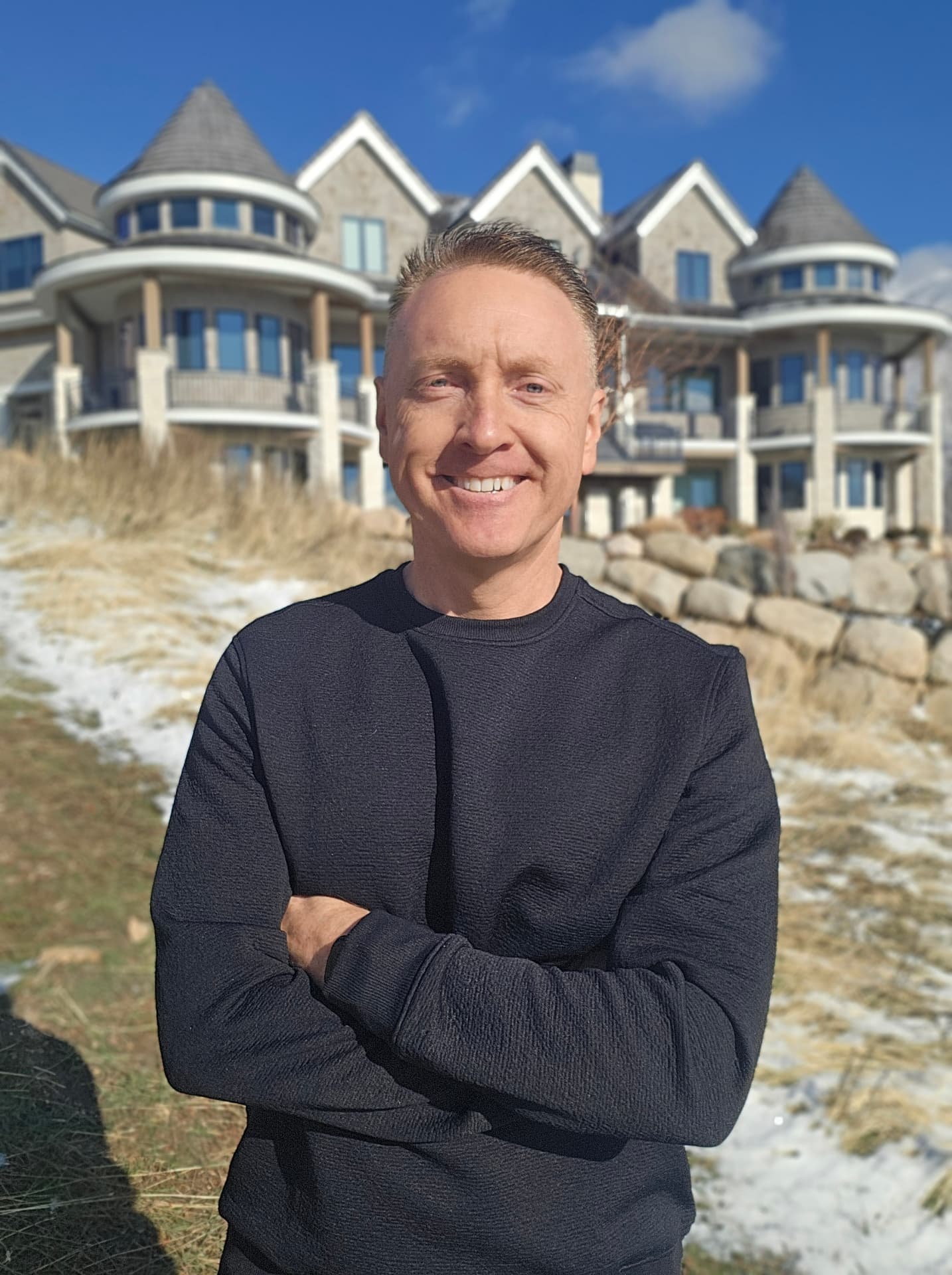 Curtis Johnson outside a luxury estate